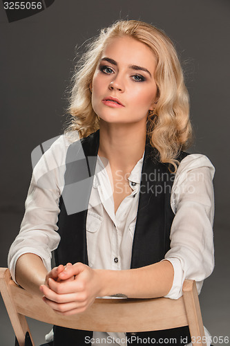 Image of Beauty blond woman on chair