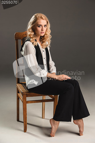 Image of Beauty blond woman on chair