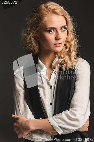 Image of Beauty blond woman on a gray background