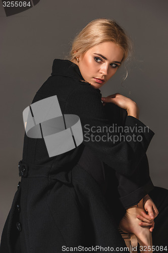 Image of Beauty blond woman on chair