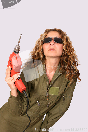 Image of Woman with drilling machine