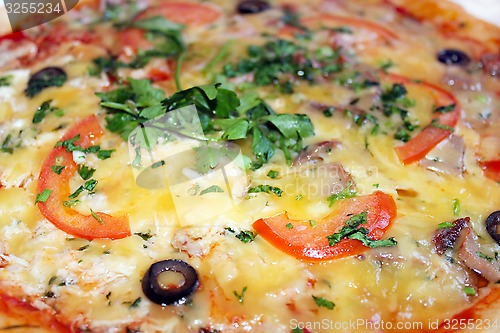 Image of pizza tasty with olives and tomatos