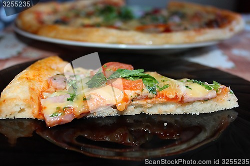 Image of appetizing pieces of pizza