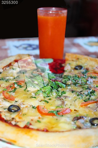 Image of pizza with tomato juice