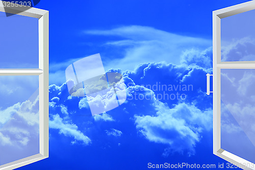 Image of window opened to picturesque white clouds