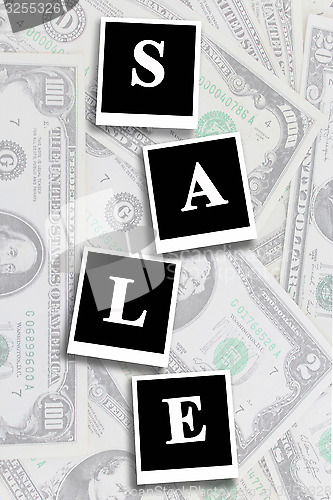 Image of word sale on the dollars background