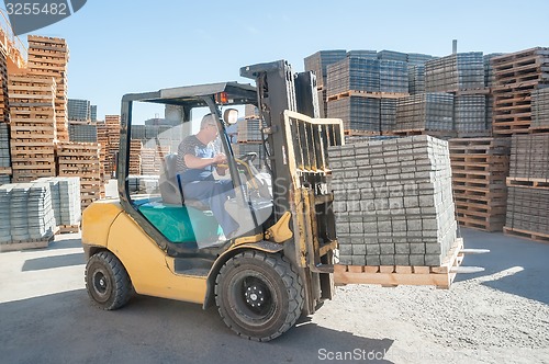 Image of Loading footwalk products at construction factory