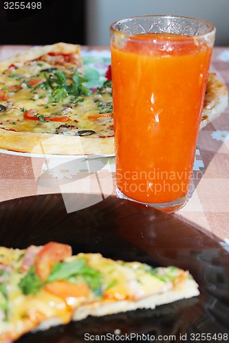 Image of pizza with tomato juice