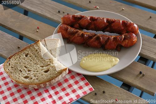 Image of delicious sausages with bread