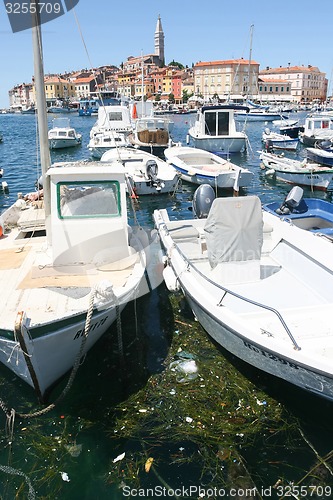 Image of Anchored boats with city of Rovinj in background