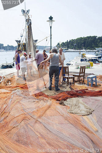 Image of Fishermen on dock 