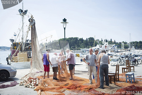 Image of Fishermen on dock in Rovinj 