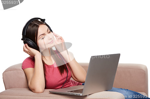 Image of Woman in headphones enjoying music