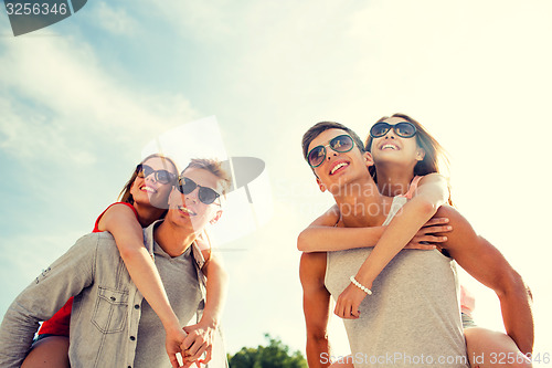 Image of smiling couple having fun in city