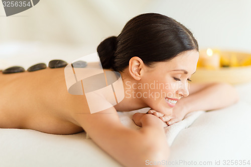 Image of woman in spa with hot stones