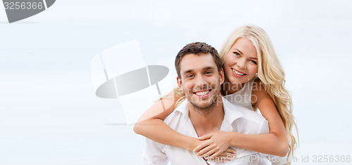 Image of couple having fun on the beach