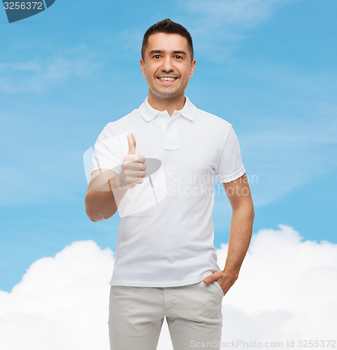 Image of smiling man showing thumbs up