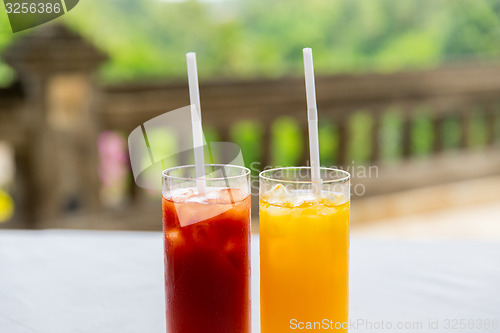 Image of glasses of fresh fruit juice at restaurant