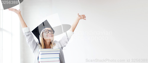 Image of happy student in graduation cap