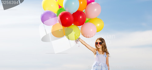 Image of happy girl with colorful balloons