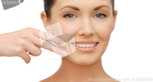 Image of face and hands of beautiful woman