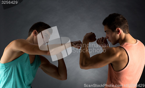 Image of young men wrestling