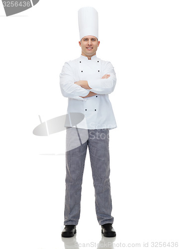 Image of happy male chef cook with crossed hands
