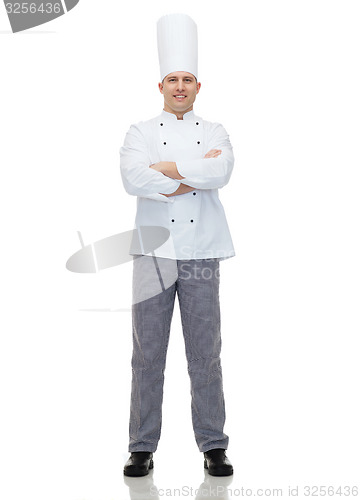 Image of happy male chef cook with crossed hands