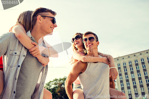 Image of smiling couple having fun in city