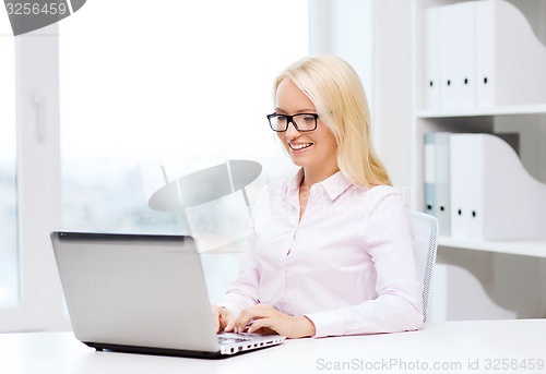 Image of smiling businesswoman or student with laptop