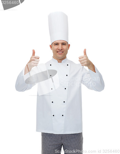 Image of happy male chef cook showing thumbs up