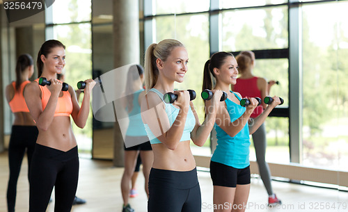 Image of group of women with dumbbells in gym