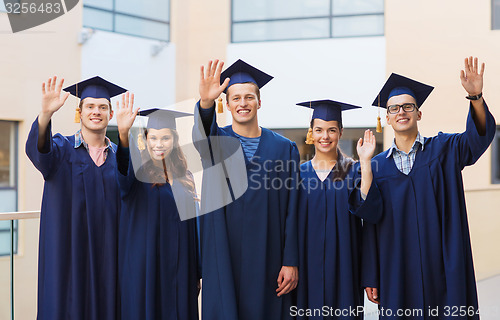 Image of group of smiling students in mortarboards