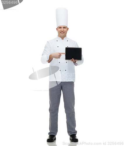 Image of happy male chef cook showing with tablet pc