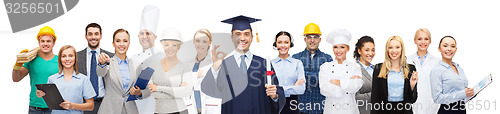 Image of happy bachelor with diploma over professionals