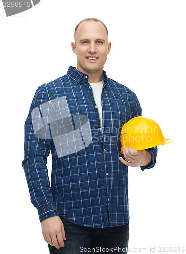 Image of smiling man in helmet with gloves