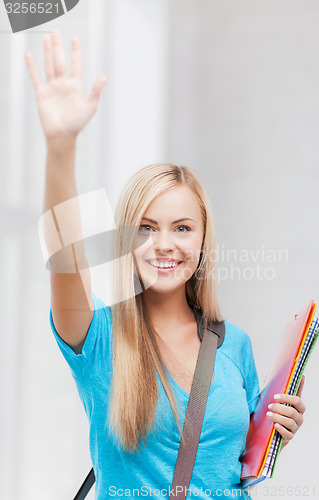 Image of student with folders