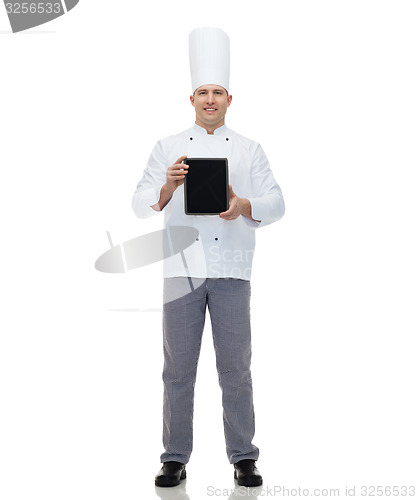 Image of happy male chef cook showing with tablet pc