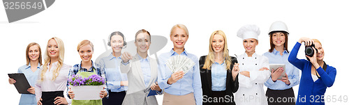 Image of woman holding money over professional workers