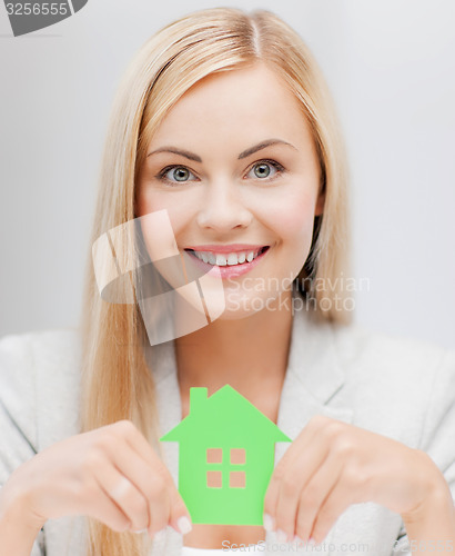 Image of woman with illustration of eco house