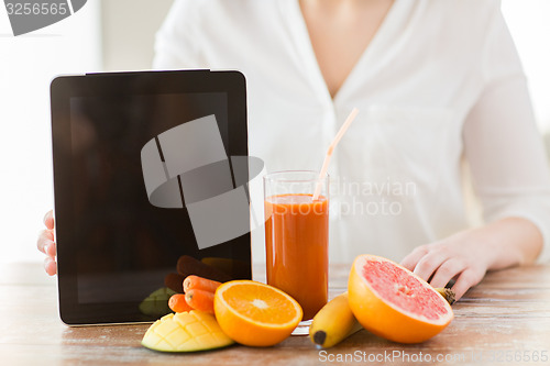 Image of close up of woman hands with juice and fruits