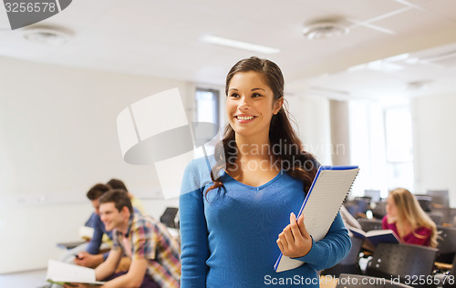 Image of group of smiling students in lecture hall