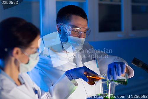 Image of close up of scientists making test in lab