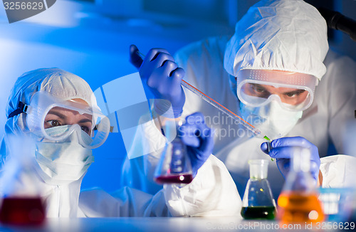 Image of close up of scientists making test in lab