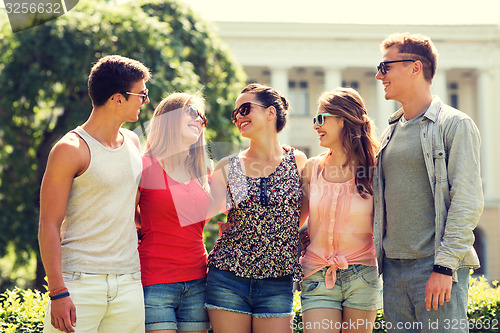 Image of group of smiling friends outdoors