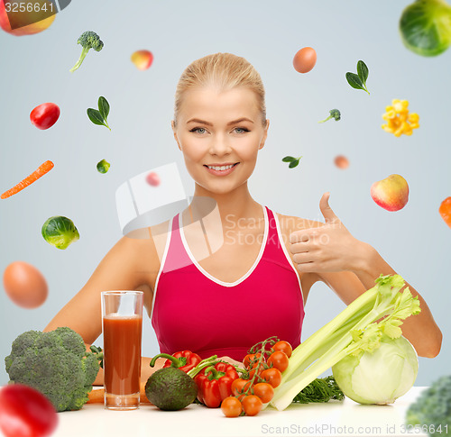 Image of happy woman with vegetarian food showing thumbs up