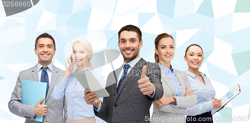 Image of group of smiling businessmen showing thumbs up