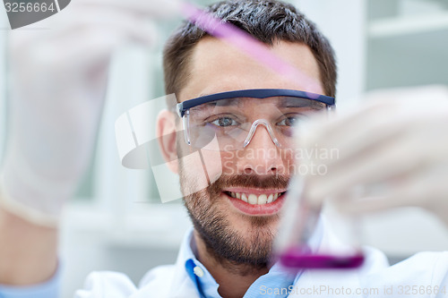 Image of young scientist making test or research in lab