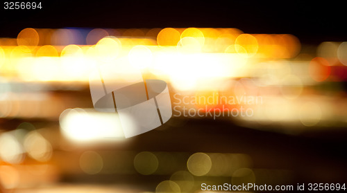 Image of golden bright lights on dark night background