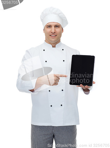 Image of happy male chef cook showing with tablet pc